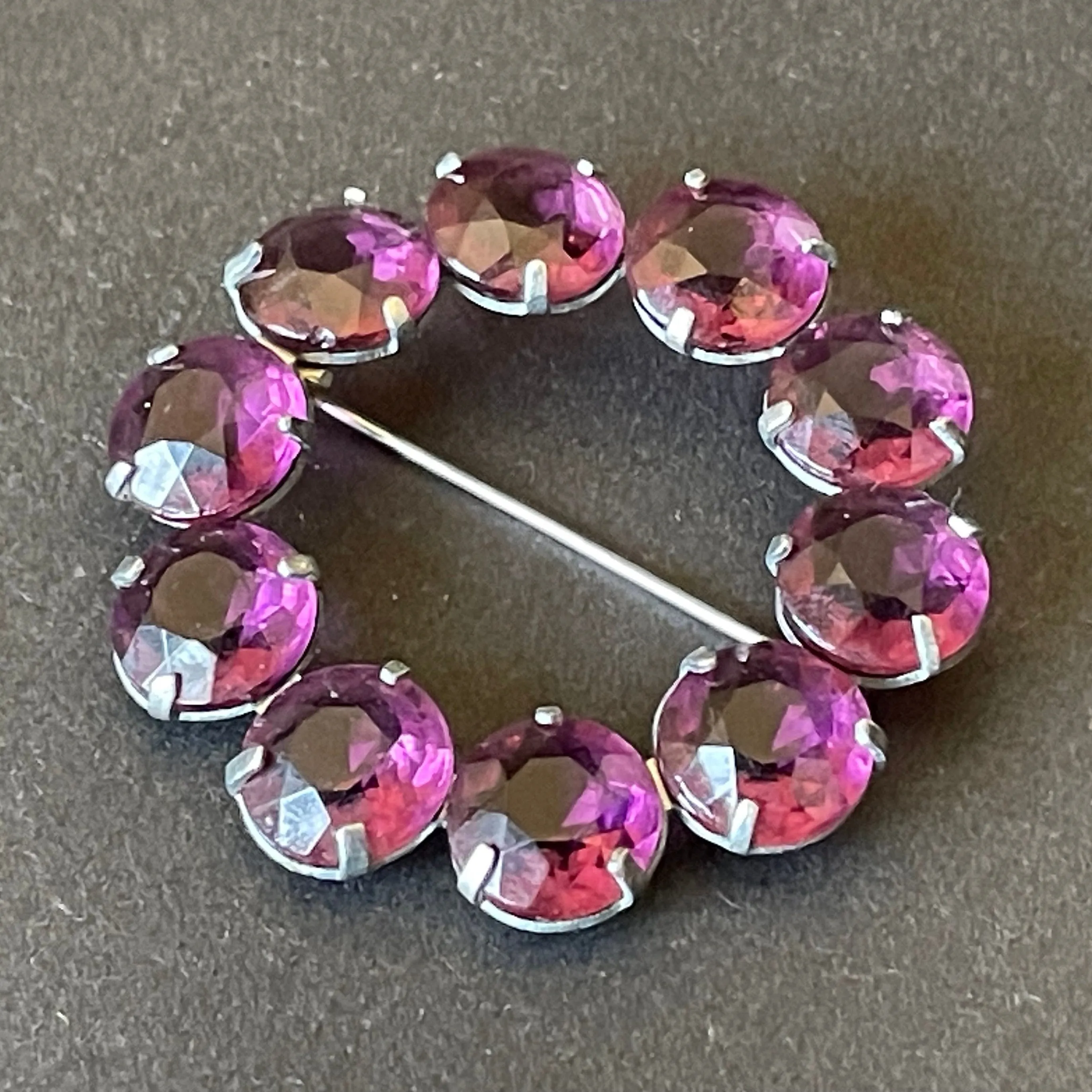 Vintage Art Deco bezel set gorgeous vibrant amethyst purple crystal riviere circle brooch, open-backed rhinestones in silver tone